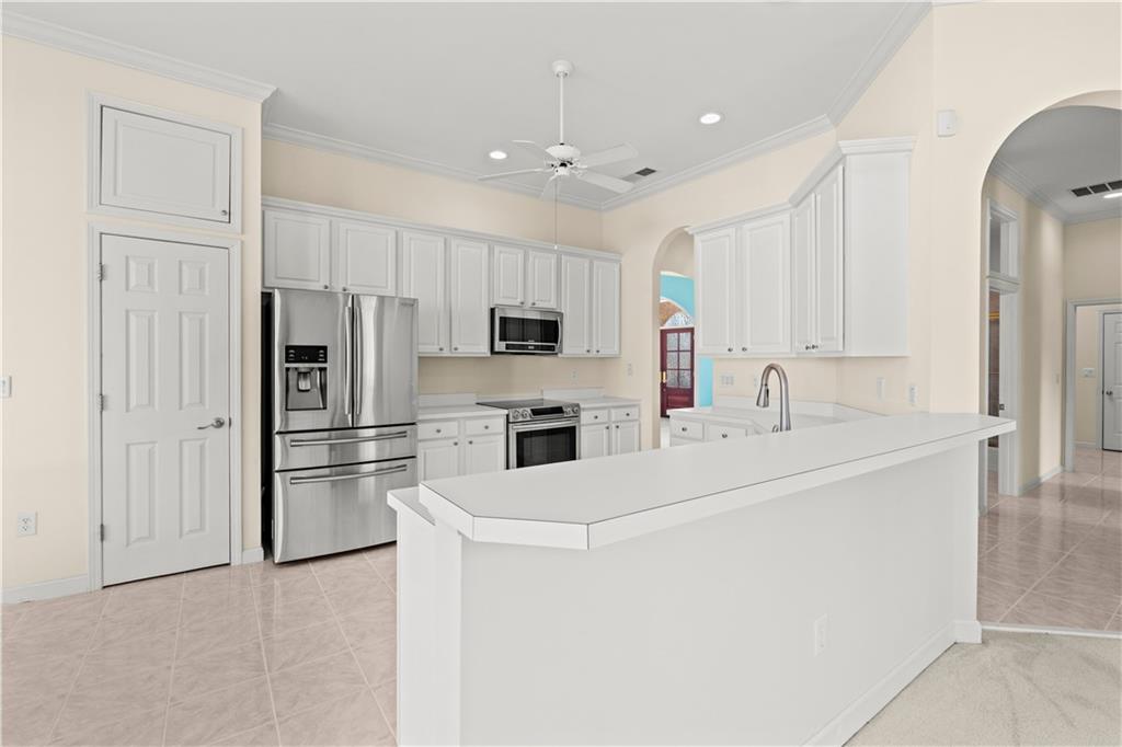 196 Lakeridge Drive Temple, GA 30179 - Photo 17 of 62 a kitchen with stainless steel appliances a refrigerator sink and microwave