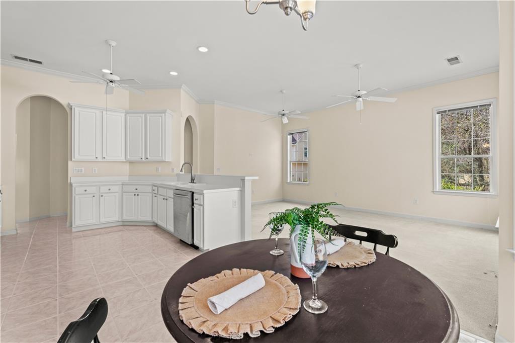 196 Lakeridge Drive Temple, GA 30179 - Photo 18 of 62 a view of a kitchen with kitchen island a sink stainless steel appliances and cabinets