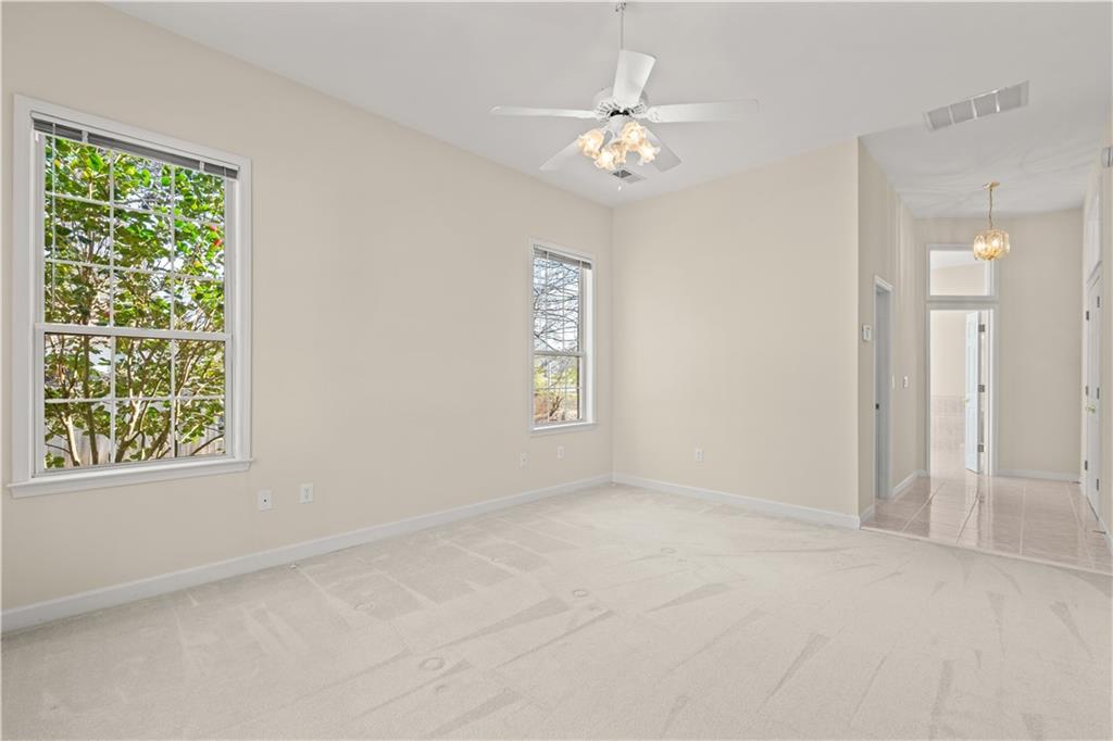 196 Lakeridge Drive Temple, GA 30179 - Photo 24 of 62 an empty room with windows and fan