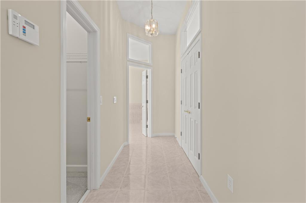 196 Lakeridge Drive Temple, GA 30179 - Photo 25 of 62 a view of a hallway with wooden floor and a bathroom