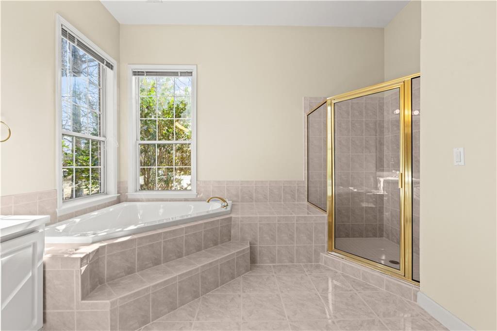 196 Lakeridge Drive Temple, GA 30179 - Photo 29 of 62 a spacious bathroom with sink and shower