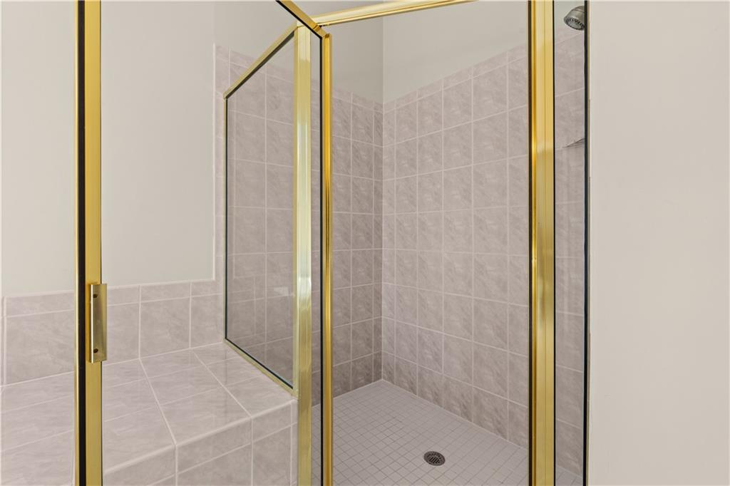 196 Lakeridge Drive Temple, GA 30179 - Photo 31 of 62 a bathroom with a glass shower door