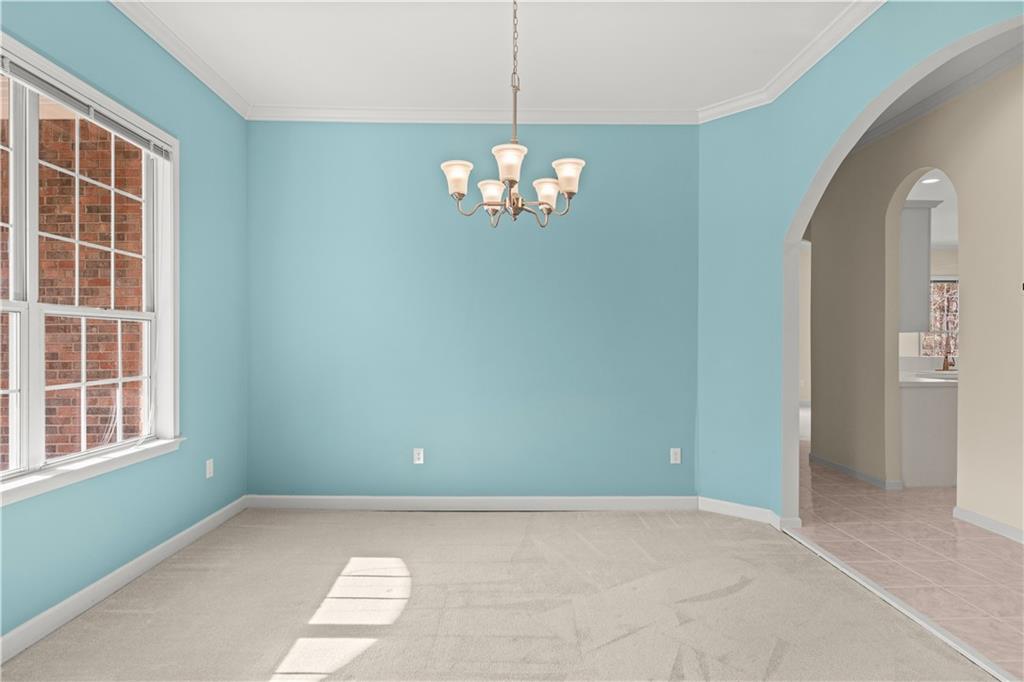 196 Lakeridge Drive Temple, GA 30179 - Photo 37 of 62 a view of a chandelier fan and wooden floor