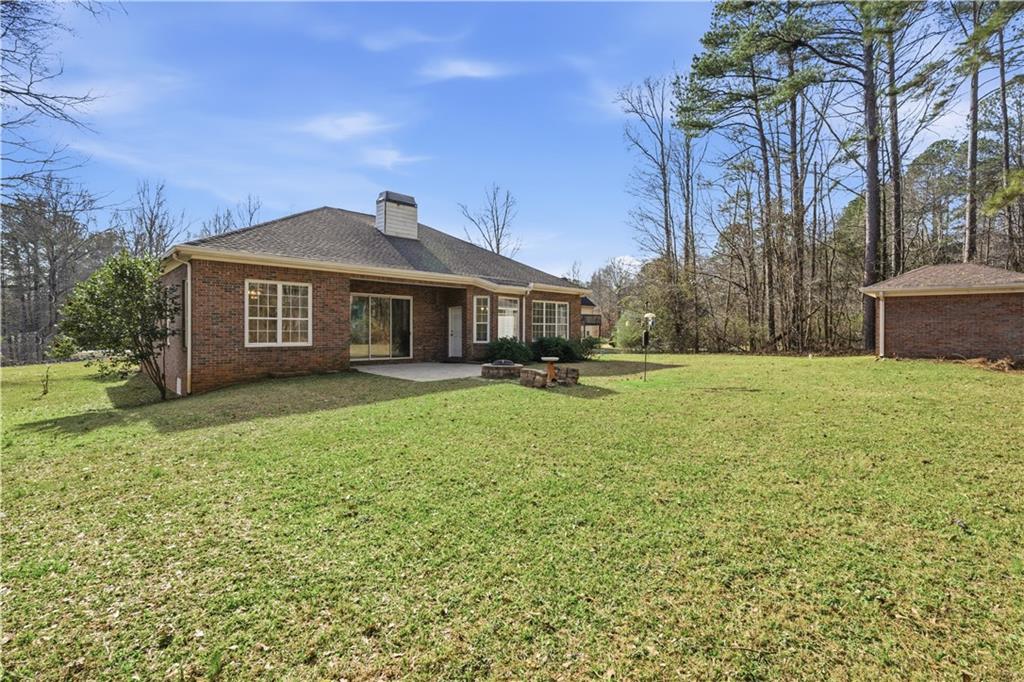 196 Lakeridge Drive Temple, GA 30179 - Photo 48 of 62 a front view of a house with a garden