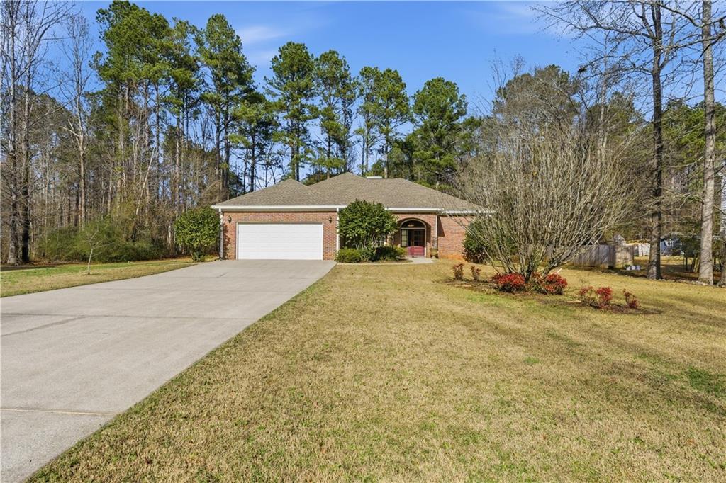 196 Lakeridge Drive Temple, GA 30179 - Photo 59 of 62 a front view of a house with a yard and garage