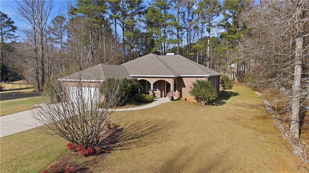 196 Lakeridge Drive Temple, GA 30179 - Photo 61 of 62 a view of a house with backyard and tree