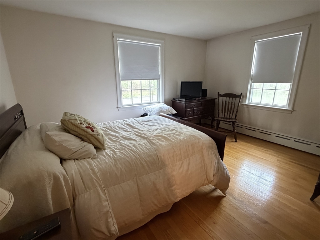 114 Parish Road Needham, MA 02494 - Photo 4 of 20 a bedroom with a bed and a window