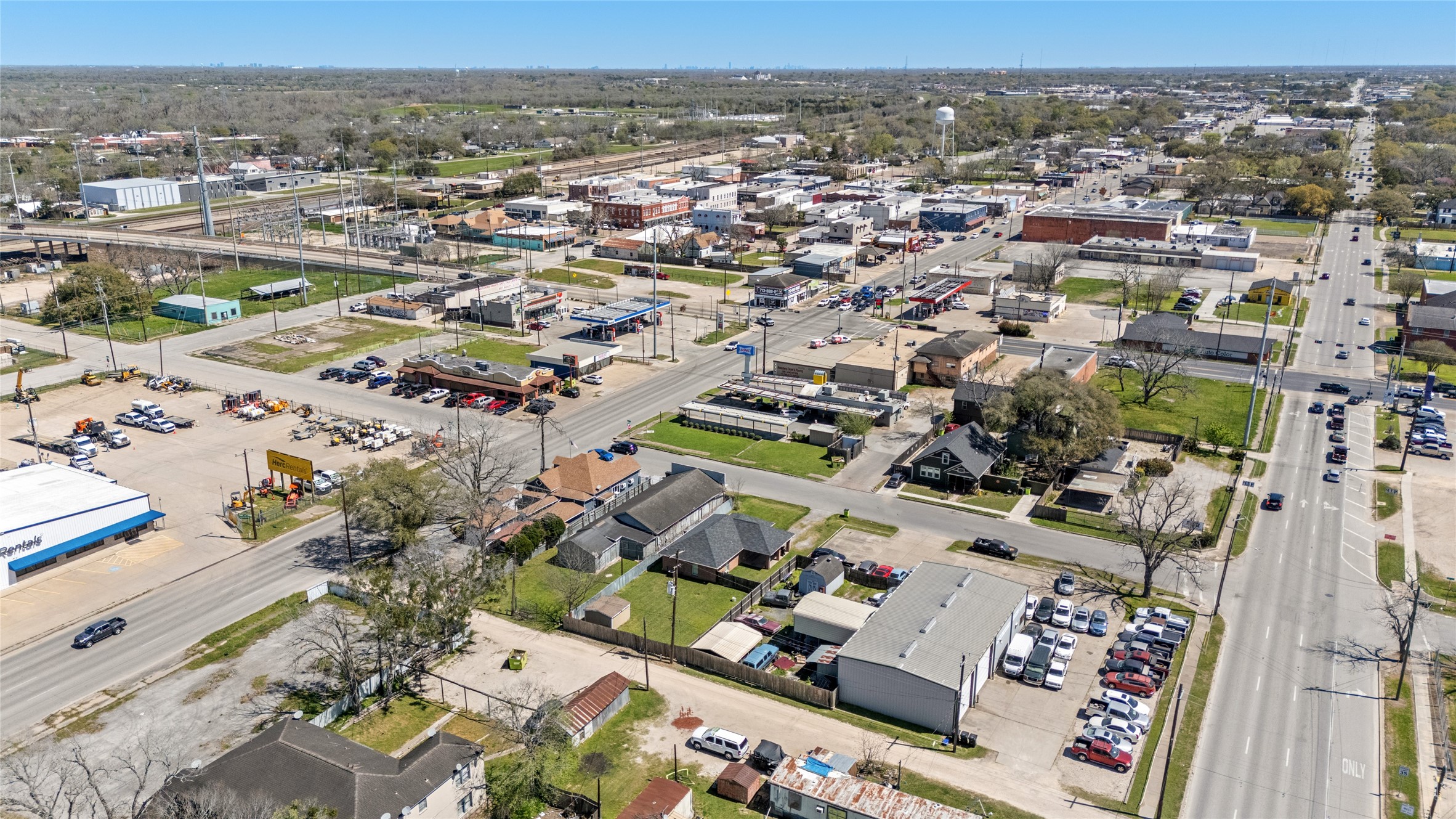 1004 Houston Street Rosenberg, TX 77471 - Photo 11 of 18 This aerial view showcases the property’s proximity to major thoroughfares, local businesses, and nearby commercial establishments. Ideal location for redevelopment with easy access to the heart of the city.