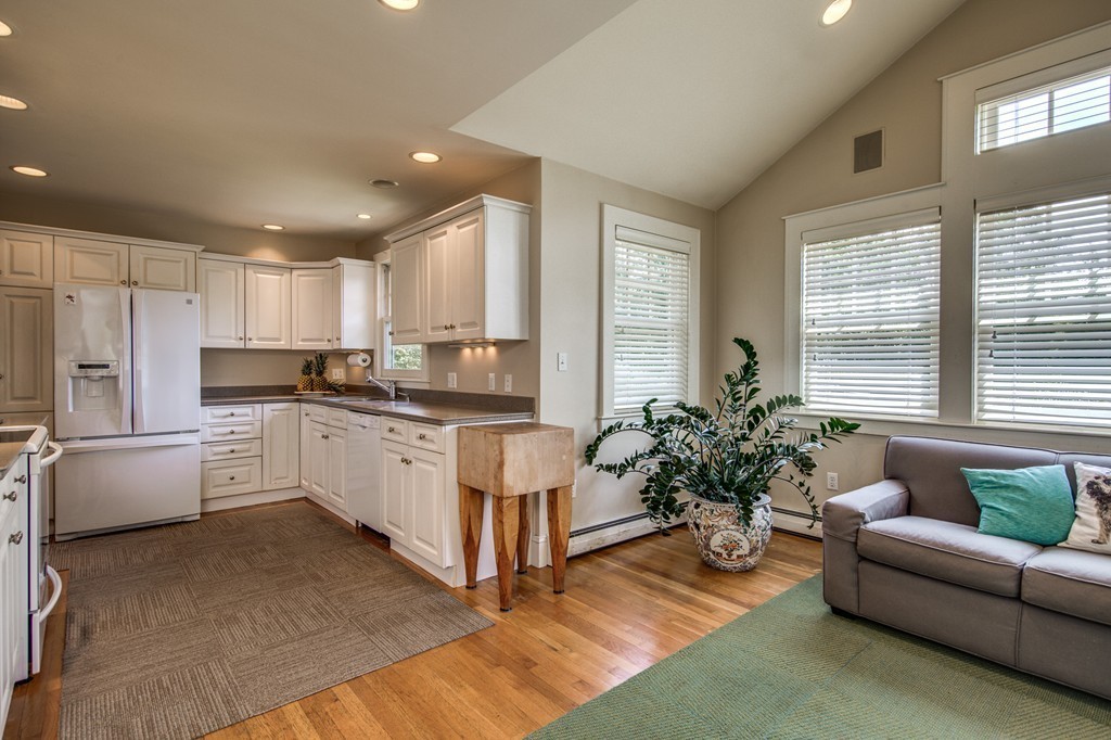 86 Eastern Point Boulevard Gloucester, MA 01930 - Photo 14 of 30 a kitchen with white cabinets and white appliances