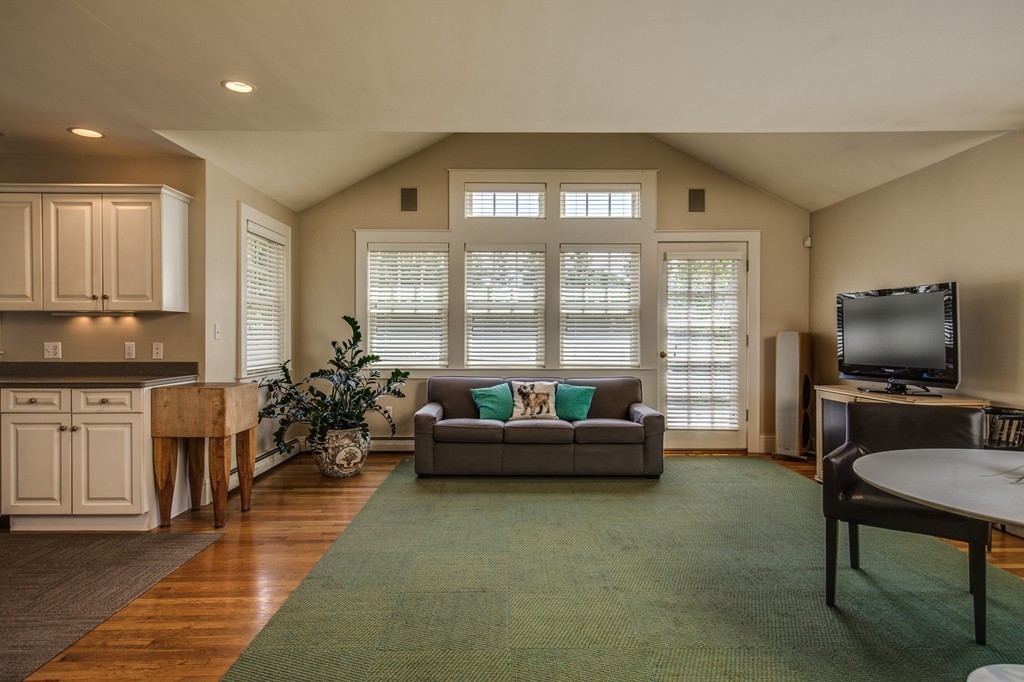 86 Eastern Point Boulevard Gloucester, MA 01930 - Photo 15 of 30 a living room with furniture and a flat screen tv