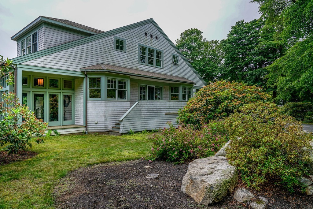 86 Eastern Point Boulevard Gloucester, MA 01930 - Photo 2 of 30 a front view of a house with a garden