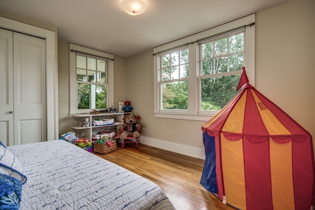86 Eastern Point Boulevard Gloucester, MA 01930 - Photo 22 of 30 a bedroom with a bed and a window