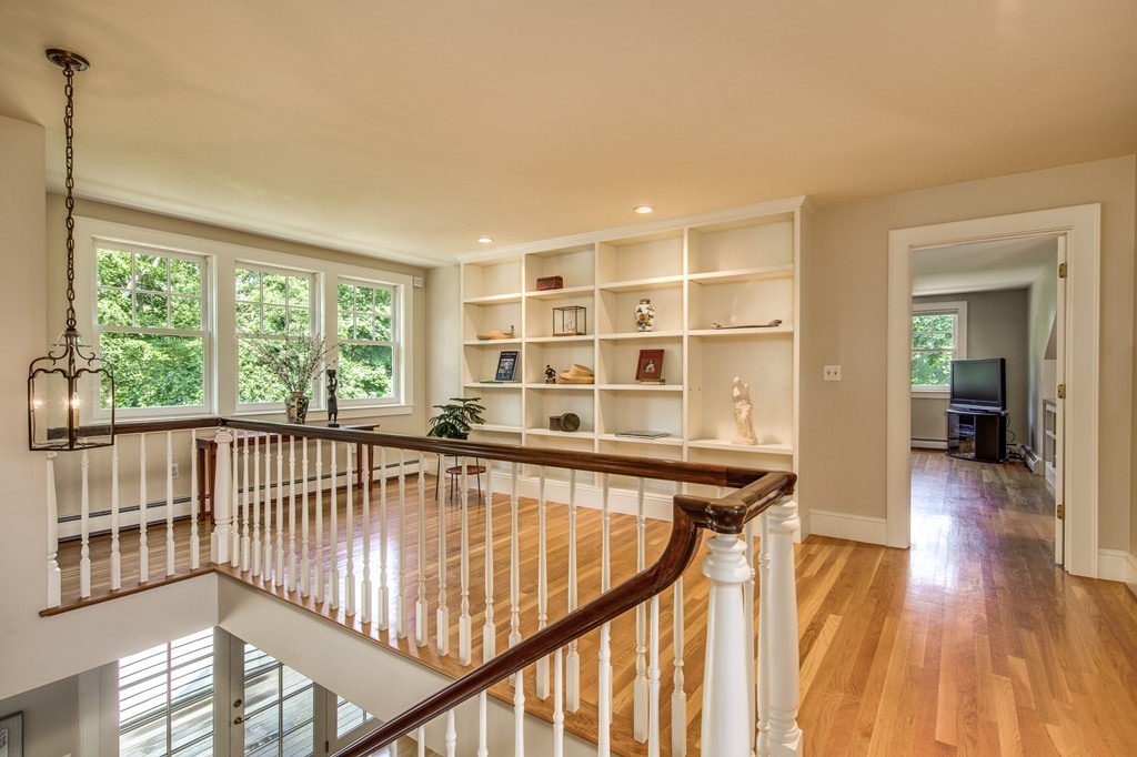 86 Eastern Point Boulevard Gloucester, MA 01930 - Photo 24 of 30 a view of a hallway with wooden floor and stairs