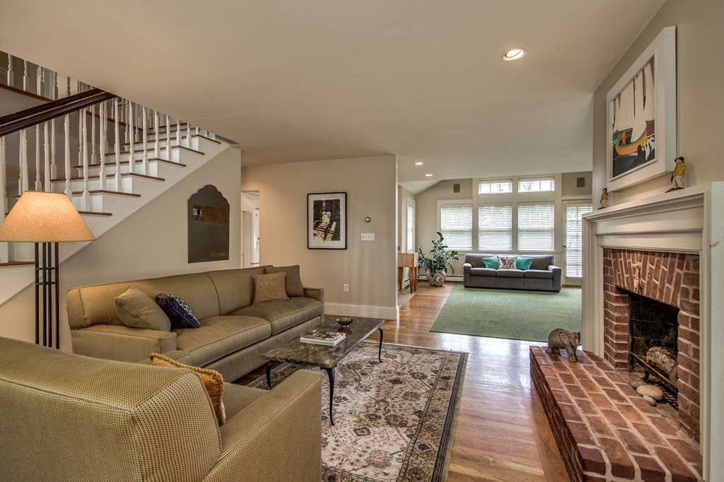 86 Eastern Point Boulevard Gloucester, MA 01930 - Photo 6 of 30 a living room with furniture and a fireplace