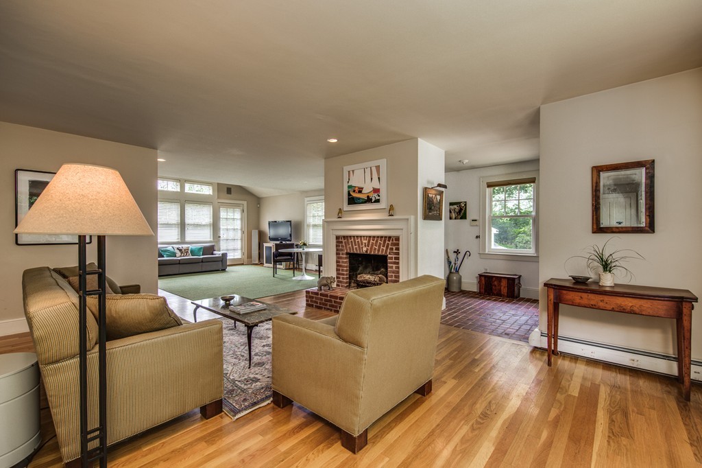 86 Eastern Point Boulevard Gloucester, MA 01930 - Photo 9 of 30 a living room with furniture and a fireplace