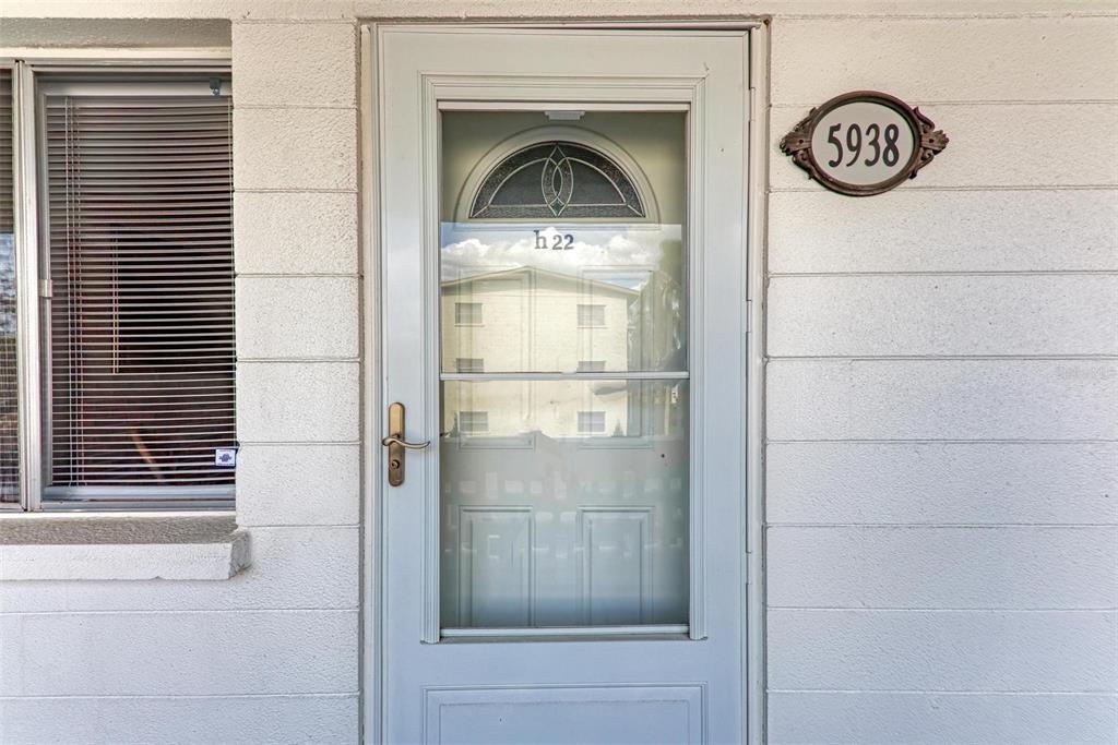 5938 Welcome Road, Unit H22 Bradenton, FL 34207 - Photo 1 of 38 a view of a wooden door of a house