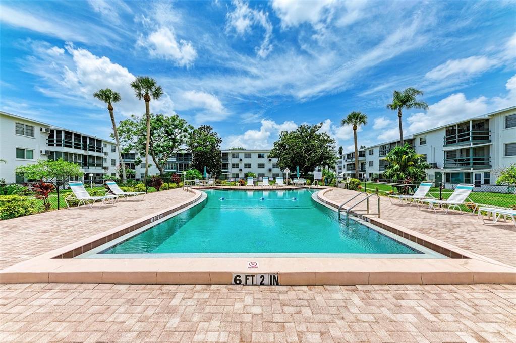 5938 Welcome Road, Unit H22 Bradenton, FL 34207 - Photo 2 of 38 a view of a swimming pool with a patio