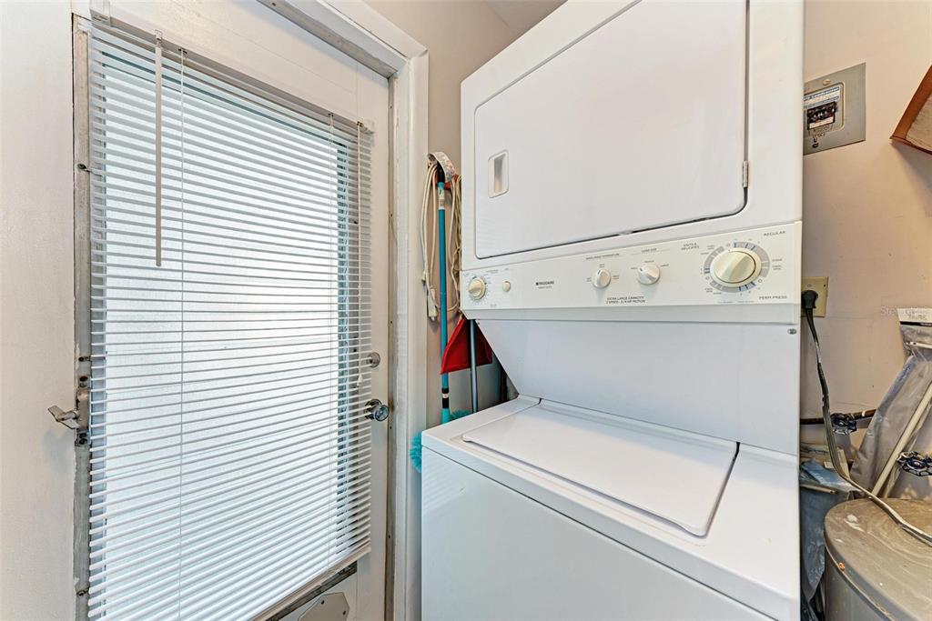 5938 Welcome Road, Unit H22 Bradenton, FL 34207 - Photo 25 of 38 a utility room with dryer and washer
