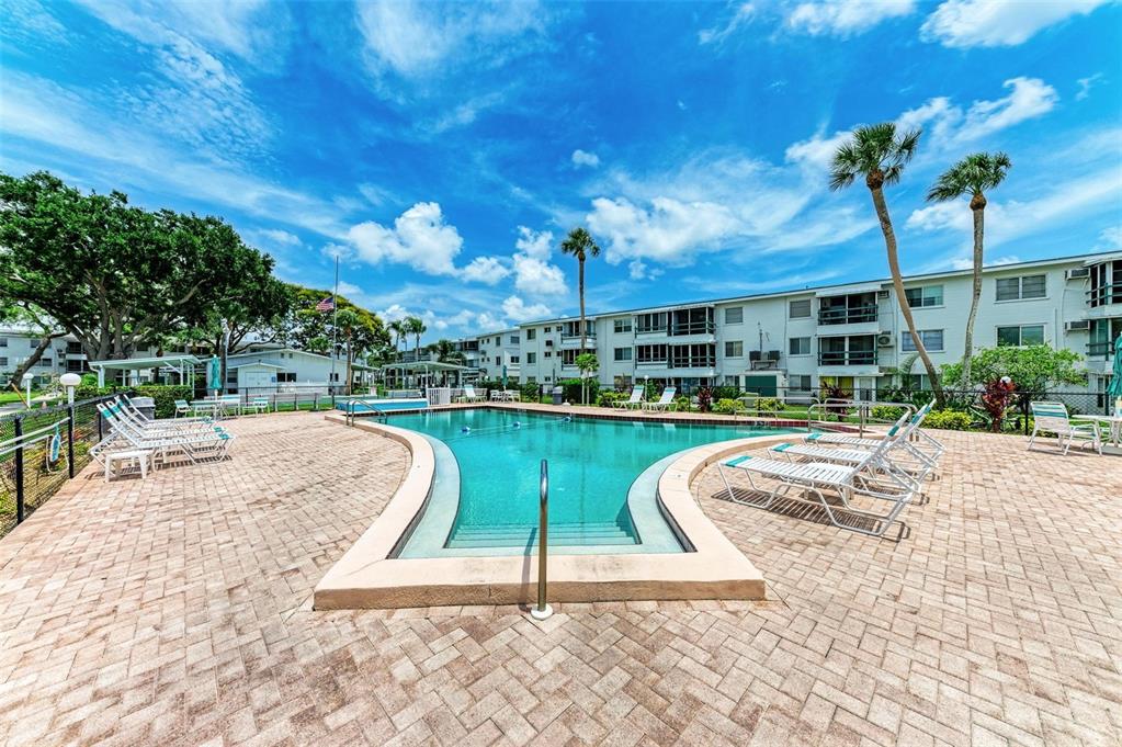 5938 Welcome Road, Unit H22 Bradenton, FL 34207 - Photo 30 of 38 a view of a swimming pool with a patio