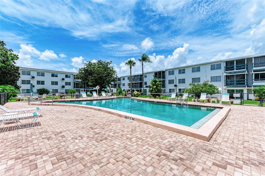 5938 Welcome Road, Unit H22 Bradenton, FL 34207 - Photo 31 of 38 a view of a swimming pool with a patio