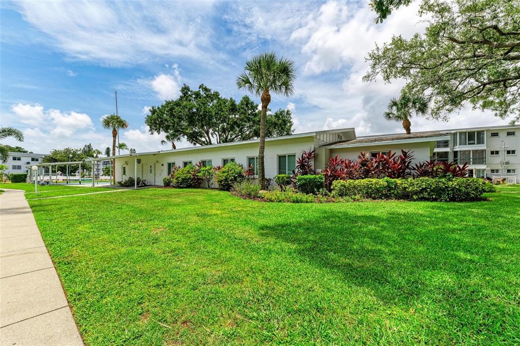 5938 Welcome Road, Unit H22 Bradenton, FL 34207 - Photo 33 of 38 a view of an house with backyard space and garden