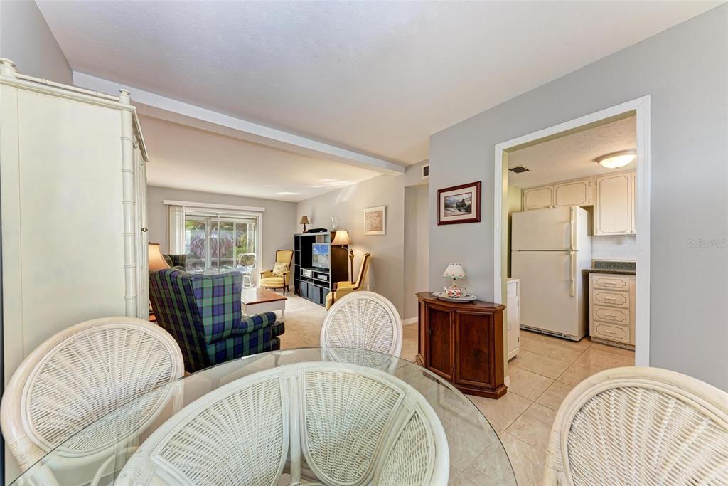 5938 Welcome Road, Unit H22 Bradenton, FL 34207 - Photo 5 of 38 a living room with furniture and wooden floor