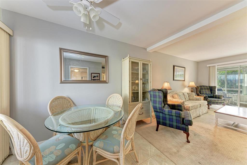 5938 Welcome Road, Unit H22 Bradenton, FL 34207 - Photo 6 of 38 a living room with furniture and a window