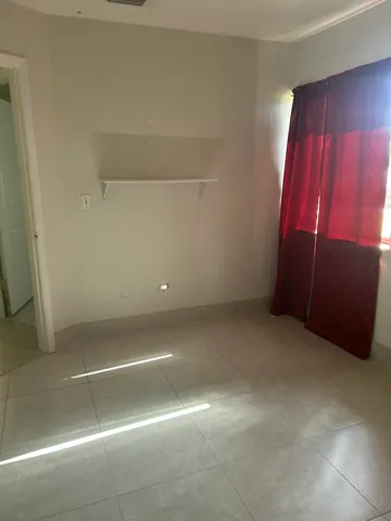 a view of a bathroom with a shower and a sink