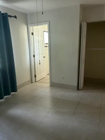 en empty room with windows