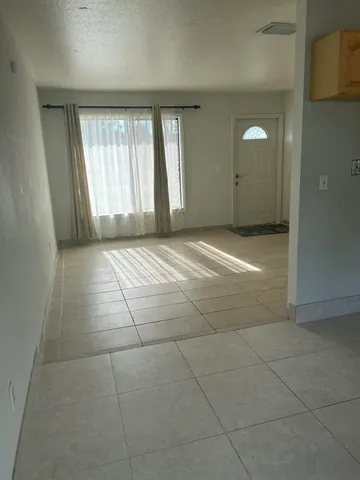 a view of an empty room and window