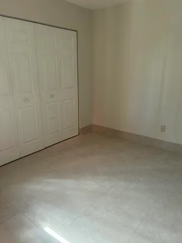 a bathroom with a sink a toilet a mirror and shower