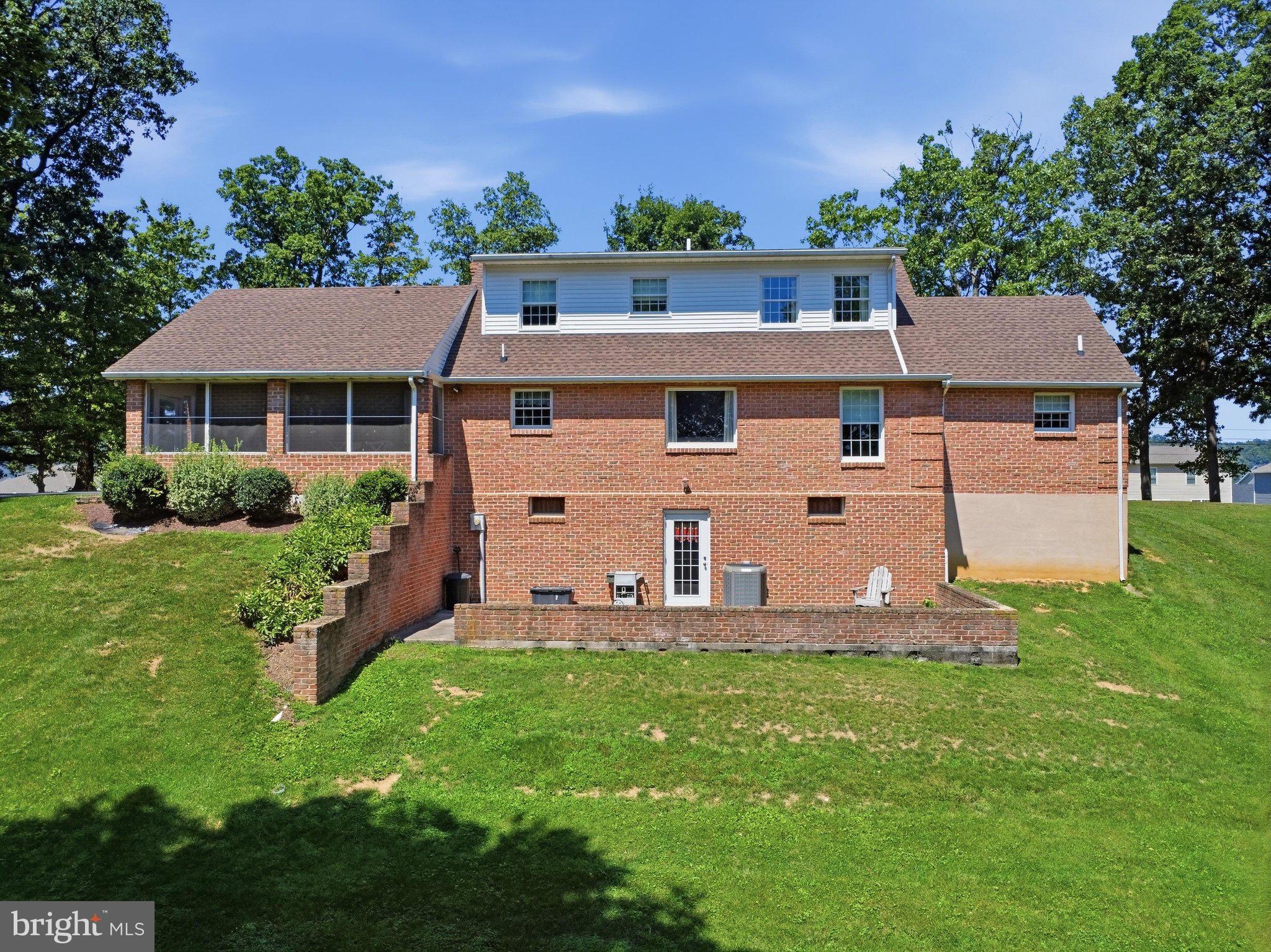 2606 Ridge Road South Martinsburg, WV 25403 - Photo 45 of 57 Charming brick home with lush green surroundings.
