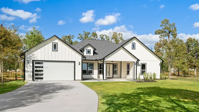 front view of a house with a garden