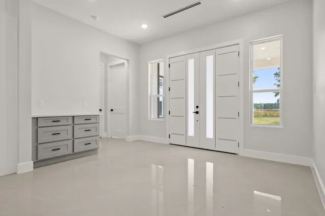 a view of a kitchen with a sink stainless steel appliances and cabinets
