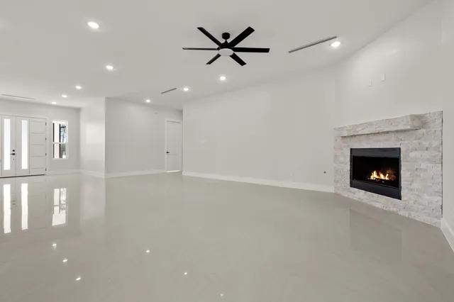 a kitchen with kitchen island white cabinets and sink