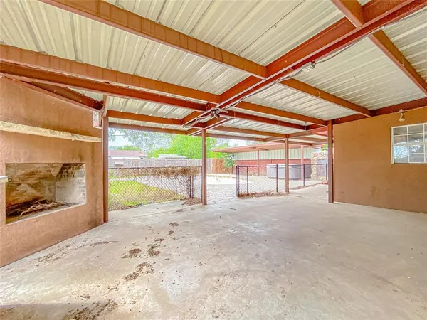 a view of a room with a bed and a large window