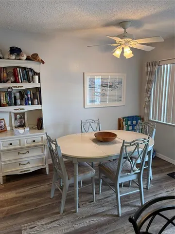a view of a dining room with furniture and window