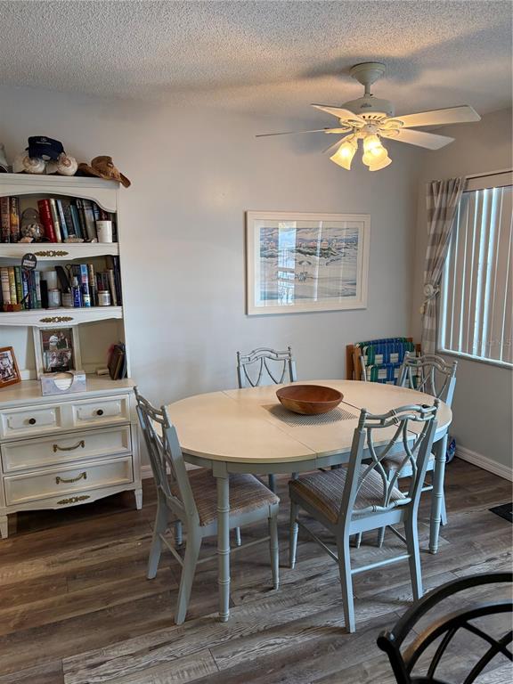 14531 Walsingham Road, Unit 204 Largo, FL 33774 - Photo 16 of 29 a view of a dining room with furniture and chandelier