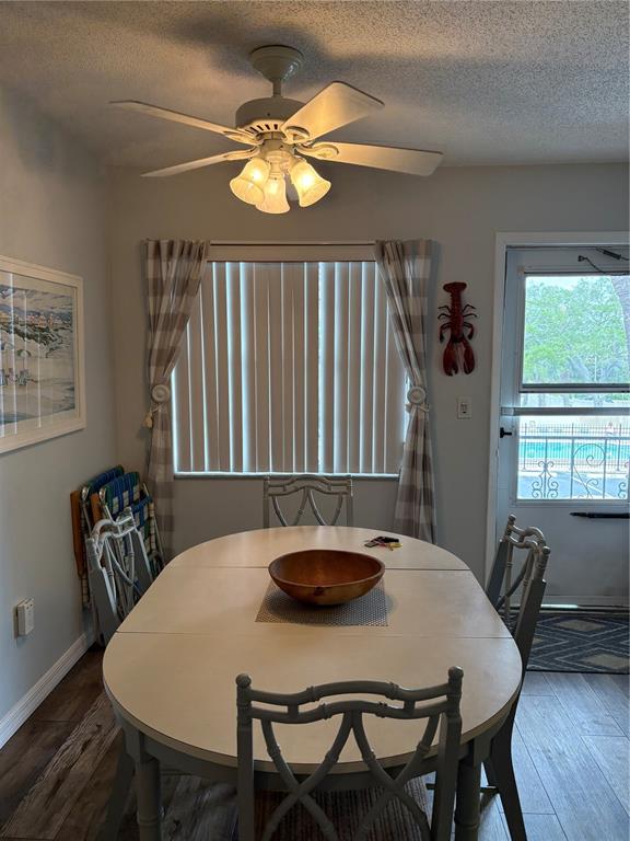 14531 Walsingham Road, Unit 204 Largo, FL 33774 - Photo 17 of 29 a view of a dining room with furniture and window