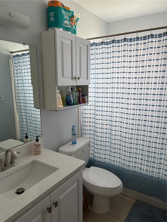 14531 Walsingham Road, Unit 204 Largo, FL 33774 - Photo 27 of 29 a bathroom with a sink toilet and shower