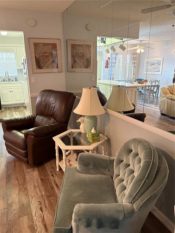 14531 Walsingham Road, Unit 204 Largo, FL 33774 - Photo 7 of 29 a living room with furniture and a couch