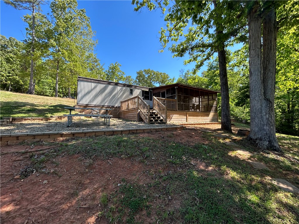 43 Sunset Cove Road Abbeville, SC 29620 - Photo 27 of 41 This tranquil setting features a screened porch and expansive outdoor living spaces, perfect for enjoying nature.