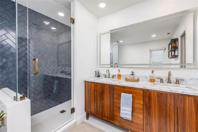 a bathroom with a shower and a sink