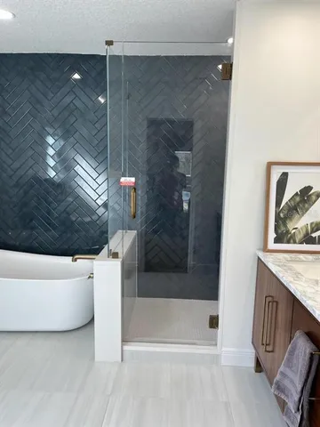 a bathroom with a bathtub and shower
