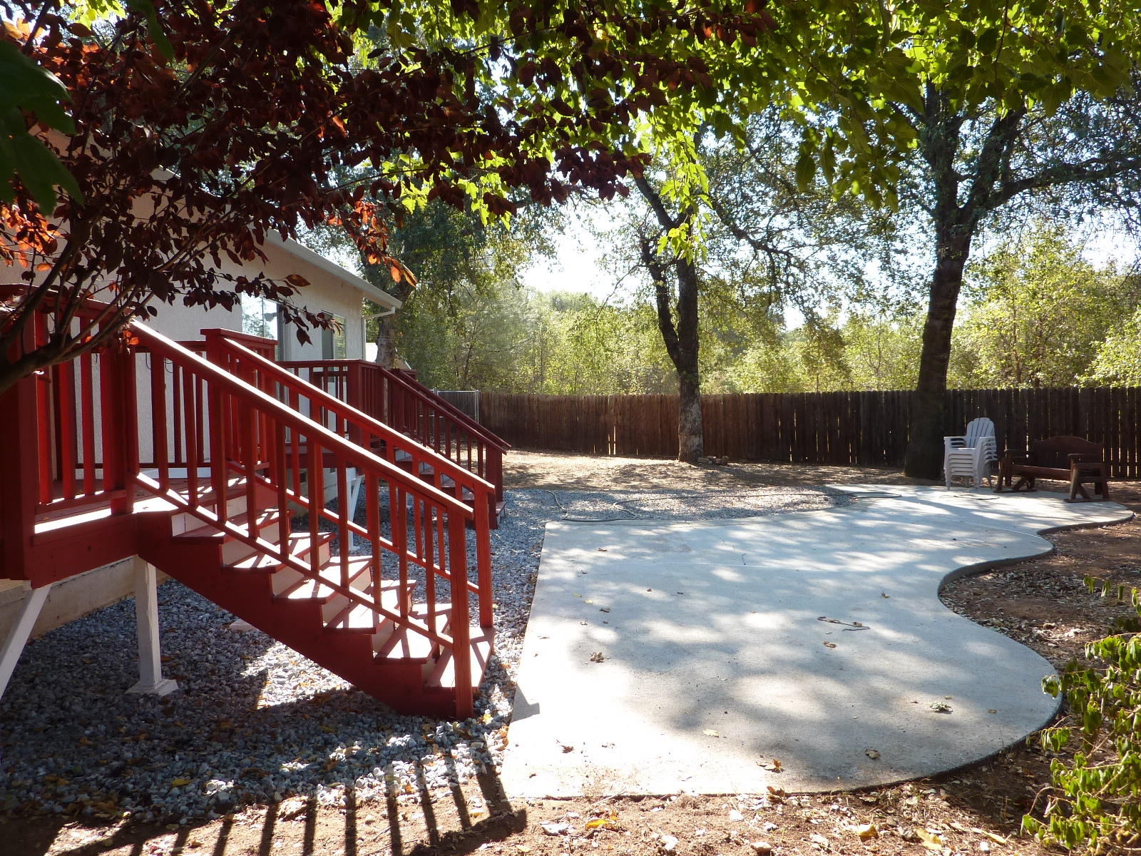 1099 Harpole Road Redding, CA 96002 - Photo 19 of 23 a view of a bench in the backyard