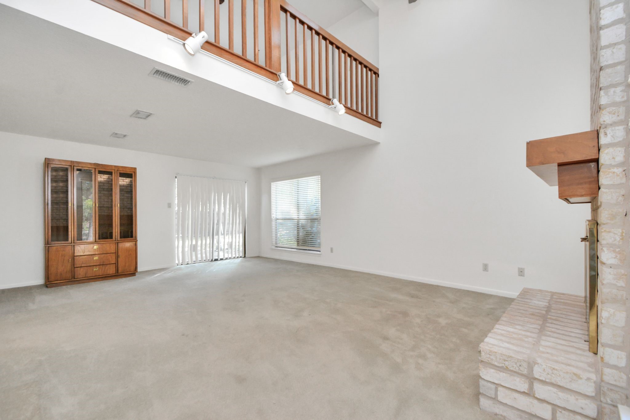 4743 Sabrina Drive Houston, TX 77066 - Photo 11 of 22 a view of an empty room with window and stairs