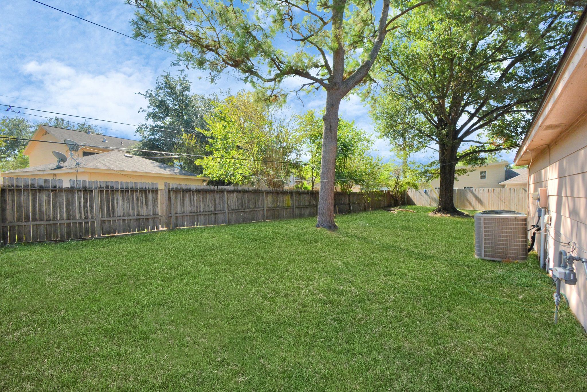 4743 Sabrina Drive Houston, TX 77066 - Photo 22 of 22 a view of a yard with a house and a large tree