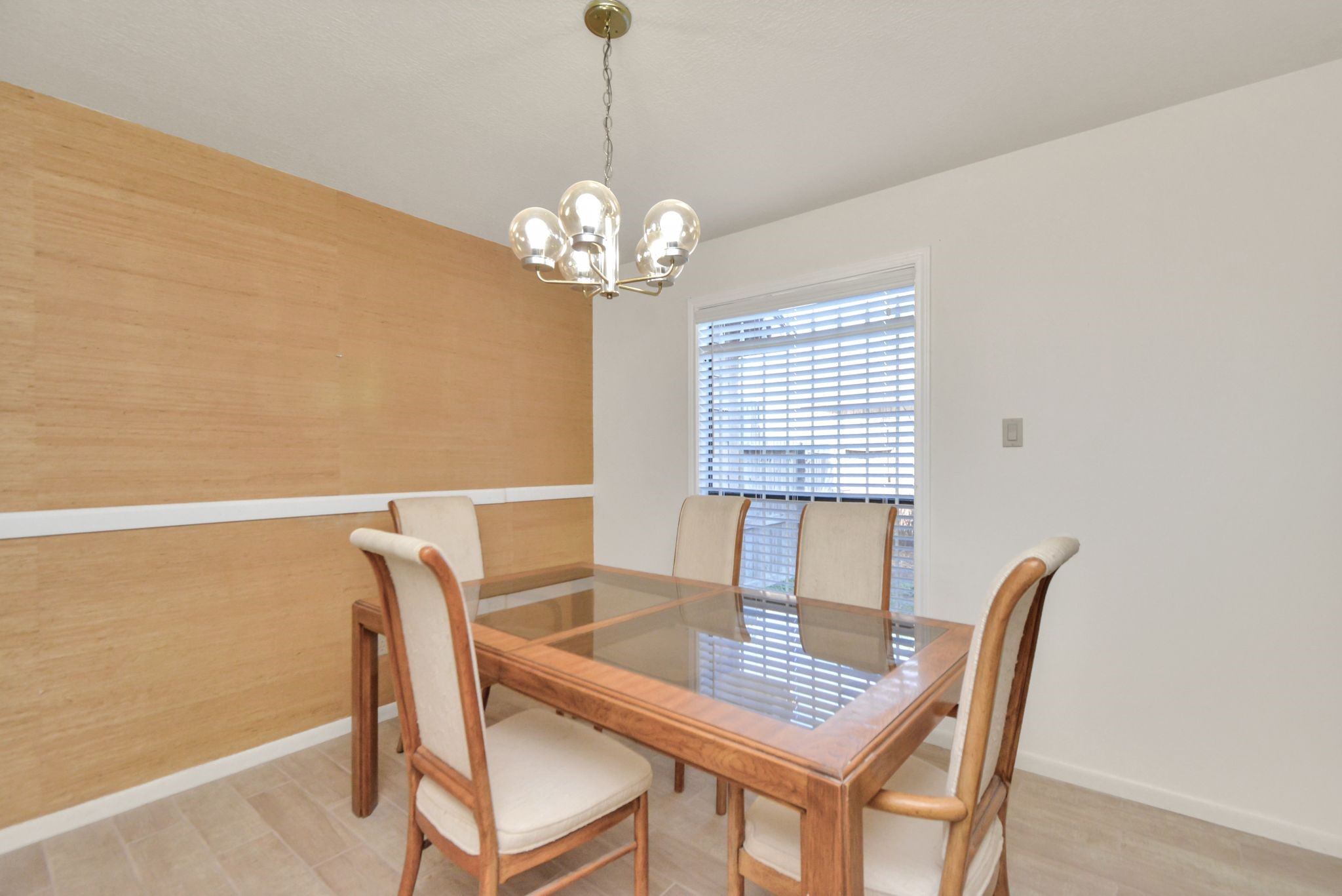 4743 Sabrina Drive Houston, TX 77066 - Photo 3 of 22 a view of a dining room with furniture wooden floor and chandelier