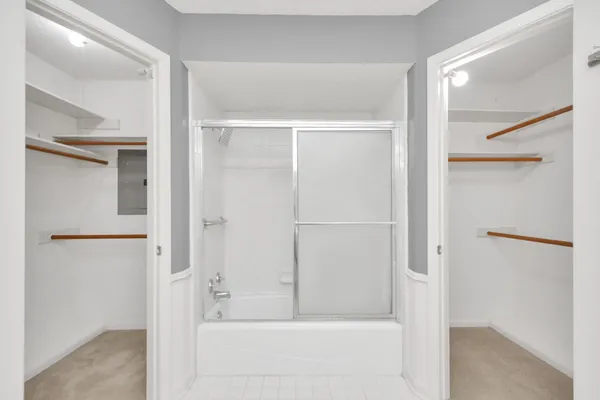 a bathroom with a bathtub and a shower