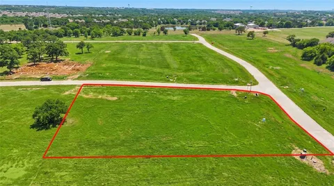 a view of a field with an ocean
